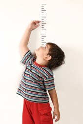 Child Measuring Growth