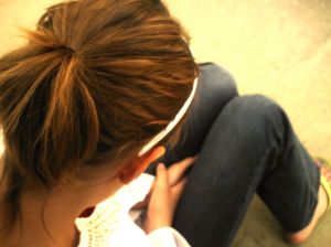 Depressed child sitting